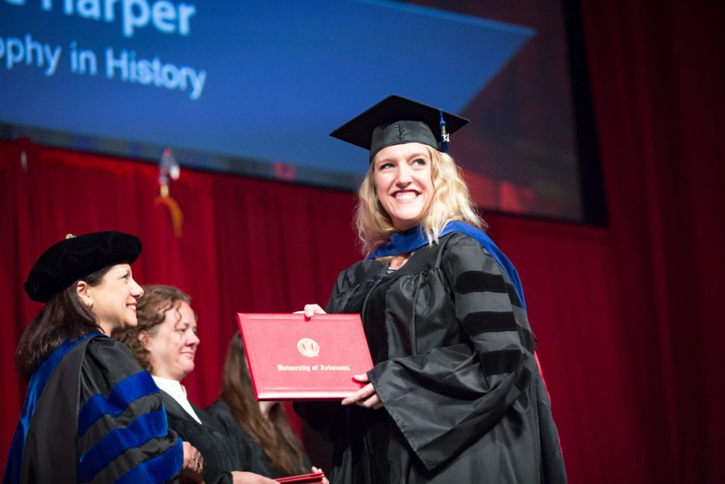 woman with diploma